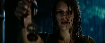 Movie still from “Friday the 13th” (2009), directed by Marcus Nispel – A person holding a gun in a dark room; Close Up shot, Low angle