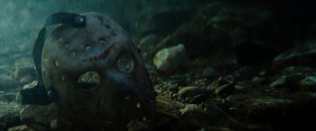 Movie still from “Friday the 13th” (2009), directed by Marcus Nispel – A mask in the water; Extreme Close Up shot, Overhead angle