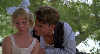 Movie still from “Fried Green Tomatoes” (1991), directed by Jon Avnet – A man and a little girl sitting next to each other; Close Up shot, Over the shoulder angle