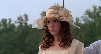 Movie still from “Fried Green Tomatoes” (1991), directed by Jon Avnet – A woman with curly brown hair wearing a hat; Close Up shot, Low angle