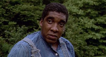 Movie still from “Fried Green Tomatoes” (1991), directed by Jon Avnet – A person wearing a jean shirt; Close Up shot, Low angle