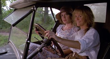 Movie still from “Fried Green Tomatoes” (1991), directed by Jon Avnet – Two women sitting in the back seat of a car; Medium shot, Low angle