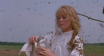 Movie still from “Fried Green Tomatoes” (1991), directed by Jon Avnet – A woman holding a mason jar full of flies; Medium shot, Low angle
