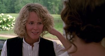 Movie still from “Fried Green Tomatoes” (1991), directed by Jon Avnet – A woman is looking into the mirror of another woman's hair; Close Up shot, Over the shoulder angle