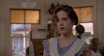 Movie still from “Fried Green Tomatoes” (1991), directed by Jon Avnet – A young woman in a blue and white polka dot dress; Close Up shot, Over the shoulder angle