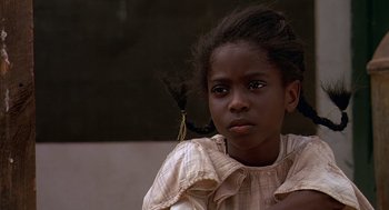 Movie still from “Fried Green Tomatoes” (1991), directed by Jon Avnet – A little girl with a long black pony tail; Close Up shot, Over the shoulder angle