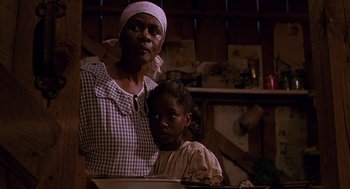 Movie still from “Fried Green Tomatoes” (1991), directed by Jon Avnet – An older woman standing next to a young girl; Close Up shot, Low angle