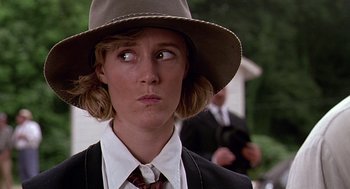Movie still from “Fried Green Tomatoes” (1991), directed by Jon Avnet – A woman wearing a hat and a suit and tie; Close Up shot, Over the shoulder angle