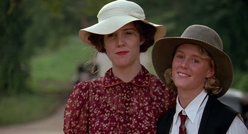 Movie still from “Fried Green Tomatoes” (1991), directed by Jon Avnet – Two women wearing hats and a red dress; Close Up shot, Low angle
