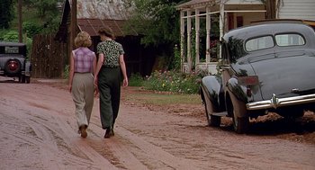 Movie still from “Fried Green Tomatoes” (1991), directed by Jon Avnet – A couple of women walking down a dirt road; Wide shot, Low angle