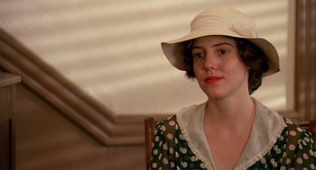 Movie still from “Fried Green Tomatoes” (1991), directed by Jon Avnet – A woman wearing a white hat and a green polka dot dress; Close Up shot, Over the shoulder angle