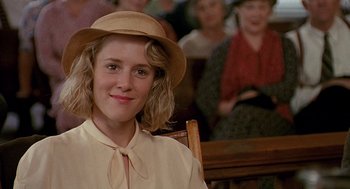 Movie still from “Fried Green Tomatoes” (1991), directed by Jon Avnet – A woman in a hat and a beige blouse; Close Up shot, Over the shoulder angle