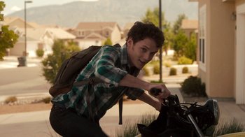 Movie still from “Fright Night” (2011), directed by Craig Gillespie – A man with a backpack on a bicycle; Medium shot, Over the shoulder angle