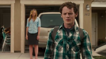 Movie still from “Fright Night” (2011), directed by Craig Gillespie – A man and a woman standing in front of a garage door; Medium shot, Over the shoulder angle