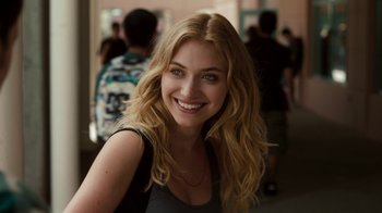 Movie still from “Fright Night” (2011), directed by Craig Gillespie – A beautiful blonde woman smiling for the camera; Close Up shot, Over the shoulder angle