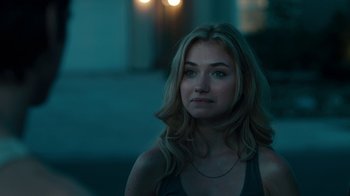 Movie still from “Fright Night” (2011), directed by Craig Gillespie – A beautiful young woman with long blonde hair wearing a necklace; Close Up shot, Over the shoulder angle