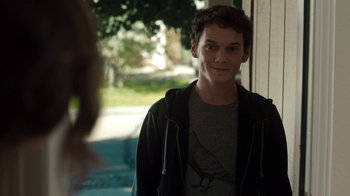 Movie still from “Fright Night” (2011), directed by Craig Gillespie – A young man standing in front of a window; Close Up shot, Over the shoulder angle