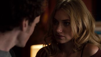 Movie still from “Fright Night” (2011), directed by Craig Gillespie – A young man and a beautiful blond woman in a dark room; Close Up shot, Over the shoulder angle