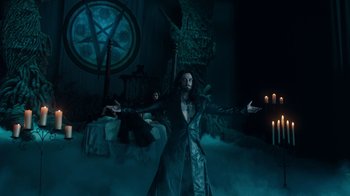 Movie still from “Fright Night” (2011), directed by Craig Gillespie – A man standing in the middle of a room with arms outstreched; Wide shot, High angle