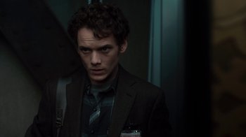Movie still from “Fright Night” (2011), directed by Craig Gillespie – A man in a suit and tie standing next to a door; Close Up shot, Over the shoulder angle