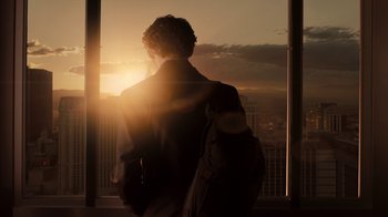 Movie still from “Fright Night” (2011), directed by Craig Gillespie – A man standing in front of a window at sunset; Medium shot, Low angle