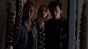 Movie still from “Fright Night” (2011), directed by Craig Gillespie – A group of people standing next to each other in a room; Medium shot, Low angle