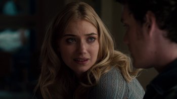 Movie still from “Fright Night” (2011), directed by Craig Gillespie – A young blonde woman looking at the camera while sitting next to a young man; Close Up shot, Over the shoulder angle