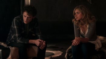 Movie still from “Fright Night” (2011), directed by Craig Gillespie – A man and a woman sitting next to each other in a room; Medium shot, Over the shoulder angle