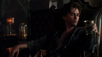 Movie still from “Fright Night” (2011), directed by Craig Gillespie – A man sitting in a chair in a dark room; Close Up shot, Over the shoulder angle