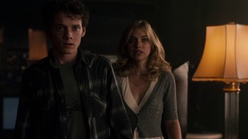 Movie still from “Fright Night” (2011), directed by Craig Gillespie – A man and a woman standing next to each other in a room; Medium shot, Over the shoulder angle