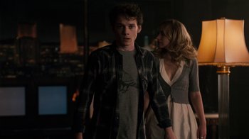 Movie still from “Fright Night” (2011), directed by Craig Gillespie – A man and a woman are walking in a room; Medium shot, Over the shoulder angle