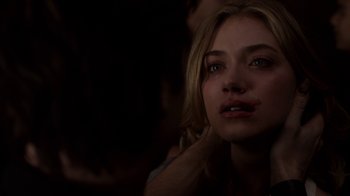 Movie still from “Fright Night” (2011), directed by Craig Gillespie – A young woman is crying in a dark room; Close Up shot, Over the shoulder angle