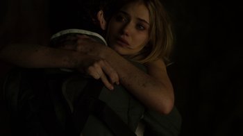 Movie still from “Fright Night” (2011), directed by Craig Gillespie – A young woman hugging a man in a dark room; Close Up shot, Over the shoulder angle