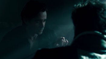 Movie still from “Fright Night” (2011), directed by Craig Gillespie – A man smoking a cigarette in a dark room; Close Up shot, Over the shoulder angle