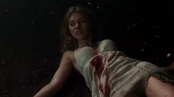 Movie still from “Fright Night” (2011), directed by Craig Gillespie – A woman laying on the ground covered in blood; Medium shot, Overhead angle