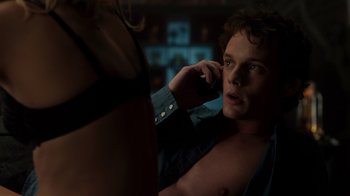 Movie still from “Fright Night” (2011), directed by Craig Gillespie – A man talking on a cell phone next to a woman; Close Up shot, Over the shoulder angle