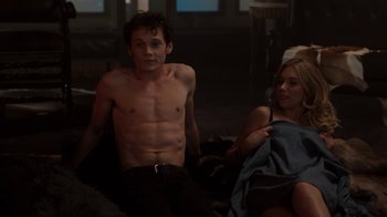 Movie still from “Fright Night” (2011), directed by Craig Gillespie – A man and a woman sitting on a couch; Medium shot, High angle