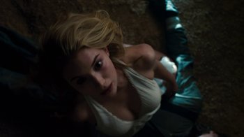 Movie still from “Fright Night” (2011), directed by Craig Gillespie – A beautiful young blond haired woman laying on the ground; Medium shot, Overhead angle