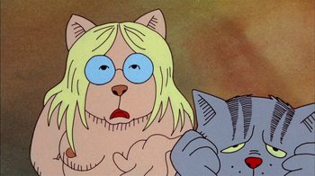 Movie still from “Fritz the Cat” (1972), directed by Ralph Bakshi – A cartoon of a cat and a woman with glasses on; Close Up shot, Low angle