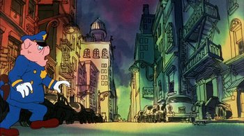 Movie still from “Fritz the Cat” (1972), directed by Ralph Bakshi – A street scene with a car and buildings in the background; Wide shot, Low angle