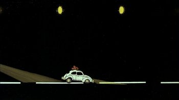 Movie still from “Fritz the Cat” (1972), directed by Ralph Bakshi – A car with a dog on the top of the car; Extreme Wide shot, Low angle