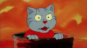 Movie still from “Fritz the Cat” (1972), directed by Ralph Bakshi – A cartoon of a gray cat with a red shirt; Close Up shot, High angle