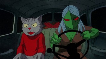 Movie still from “Fritz the Cat” (1972), directed by Ralph Bakshi – Two cartoon characters sitting in the back of a car; Medium shot, High angle