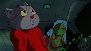 Movie still from “Fritz the Cat” (1972), directed by Ralph Bakshi – Two cartoon characters sitting next to each other in a room; Close Up shot, Low angle