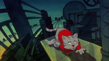 Movie still from “Fritz the Cat” (1972), directed by Ralph Bakshi – A cat is laying on a table in the middle of the night; Medium shot, High angle