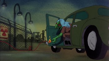 Movie still from “Fritz the Cat” (1972), directed by Ralph Bakshi – An animated creature is sitting in the back of a green car; Wide shot, High angle