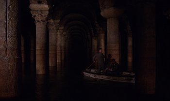 Movie still from “From Russia with Love” (1963), directed by Terence Young – Two men are in a boat in the middle of the water; Extreme Wide shot, High angle