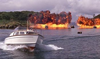 Movie still from “From Russia with Love” (1963), directed by Terence Young – A boat in the water with a bunch of smoke coming out of it; Extreme Wide shot, High angle
