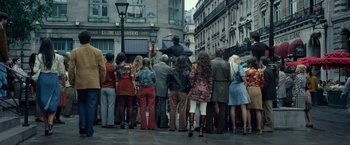 Movie still from “The Walk” (2015), directed by Robert Zemeckis – A group of people standing on the side of the street; Wide shot, Low angle