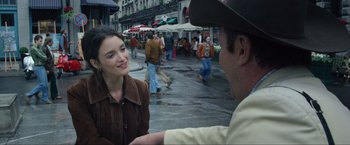 Movie still from “The Walk” (2015), directed by Robert Zemeckis – A man and a woman talking on the sidewalk; Medium shot, Over the shoulder angle